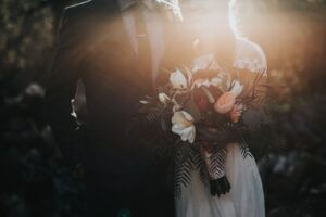 Wedding couple with a flower bouquet