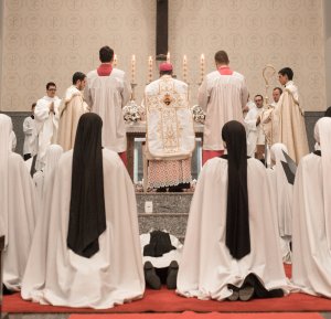 Nuns kneeling at altar