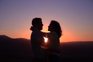 couple hugging in sunset